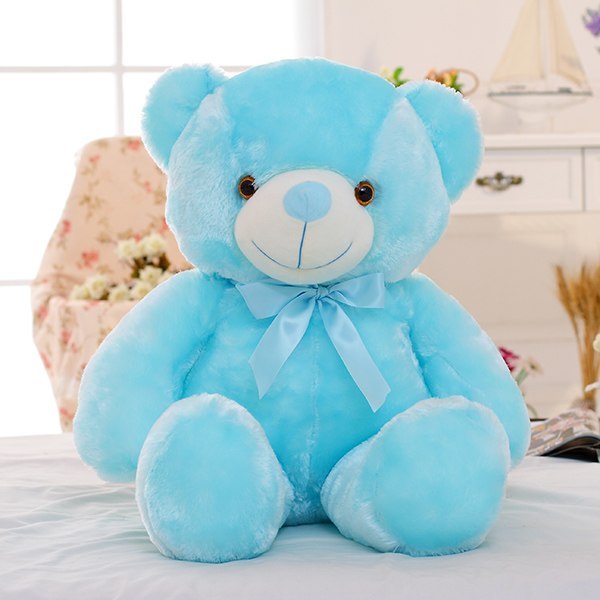 A cozy little world of joy 🧸💛 - blue plush teddy bear with bow, perfect for playtime and cuddles.